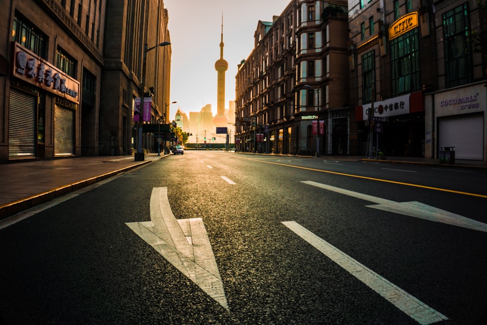 black asphalt road in middle of city during daytime