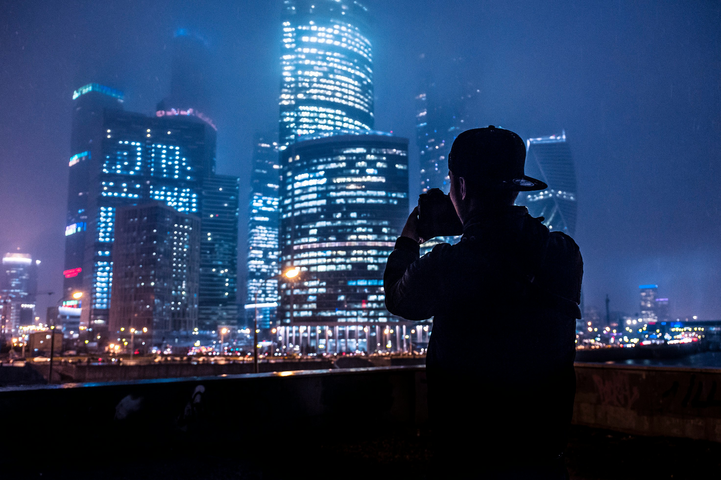 man taking a picture of the building