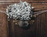 Custom resin name plate featuring delicate floral inclusions and elegant lettering