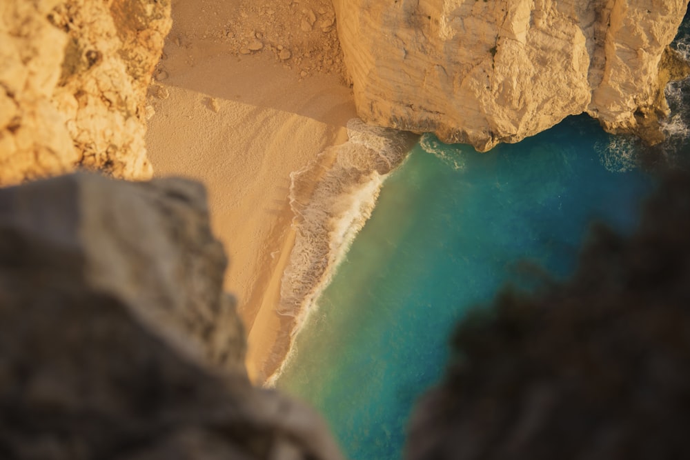 an aerial view of a beach and a cliff