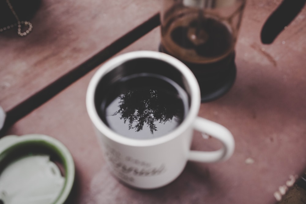 close up photo of white ceramic mug