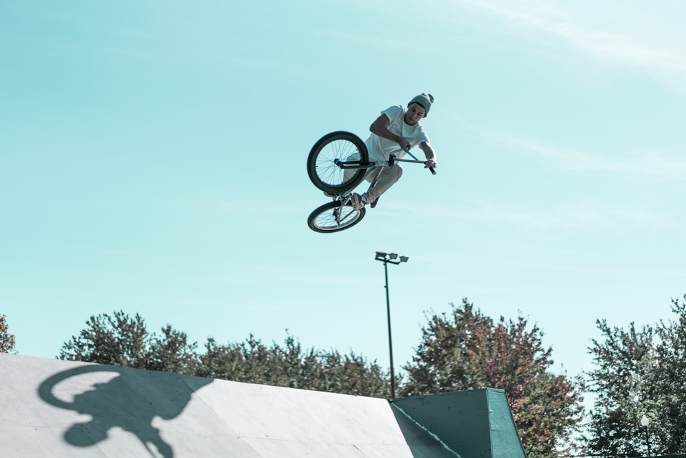 man doing BMX bike stunts