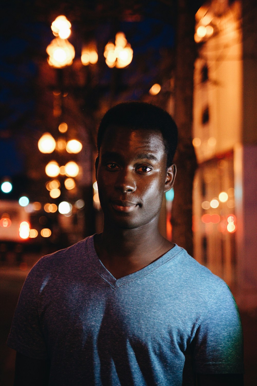 man wearing grey v-neck shirt