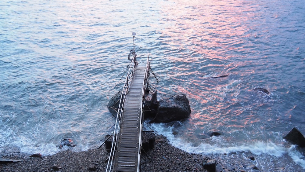 aerial view of brown wooden dock near seashore