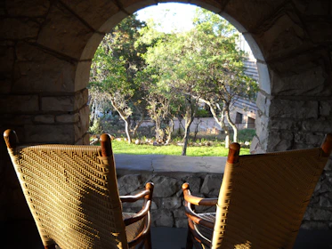 A welcoming porch area with comfortable seating overlooking the garden.