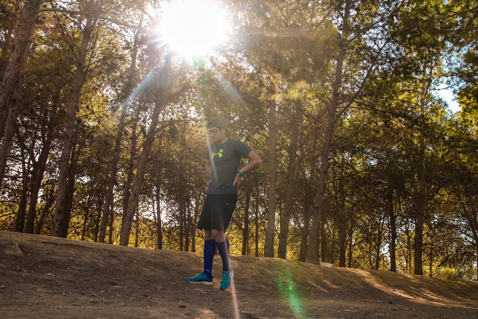 An energetic fitness enthusiast wearing oversized gym apparel, running outdoors at sunrise, embodying strength and confidence.