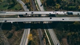 An aerial view of trucks on an interstate highway.