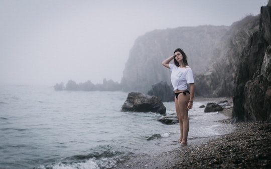 woman standing on seashore in Argelès-sur-Mer France