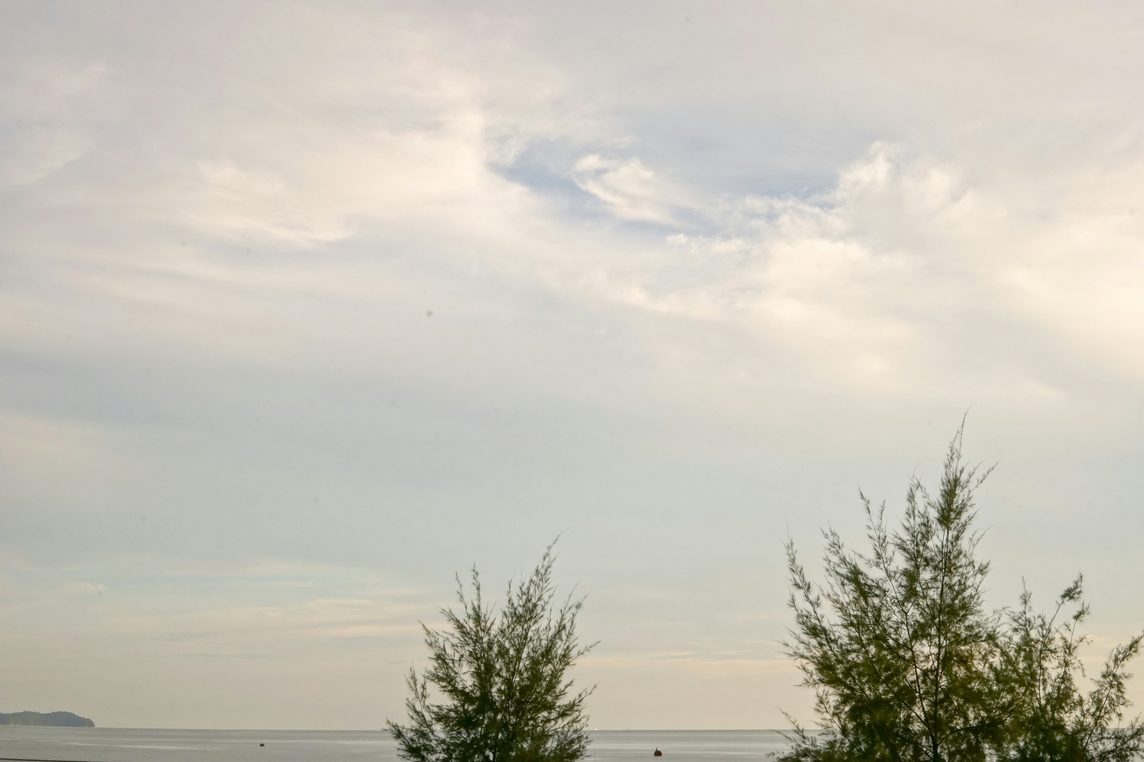 Clear sky with soft clouds, calm weather scene