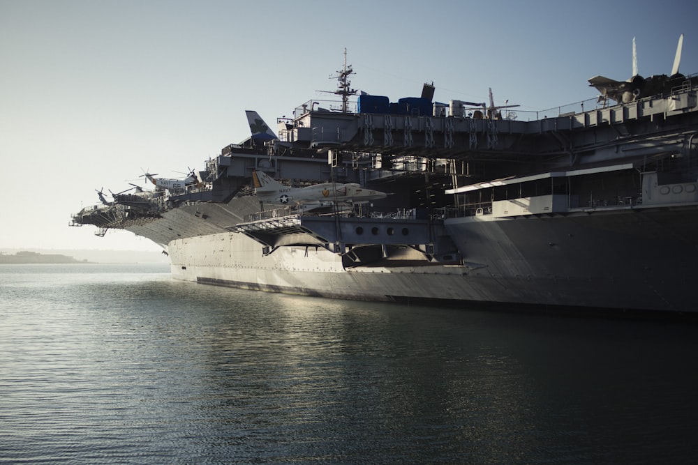 gray warship on body of water