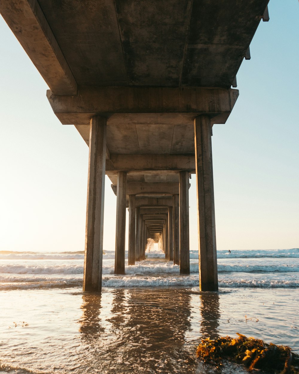 brown concrete building on beach during daytime