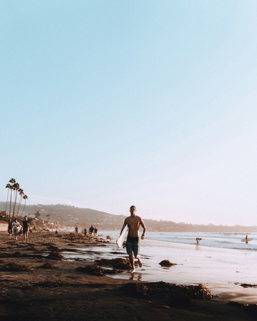 people walking on beach during daytime