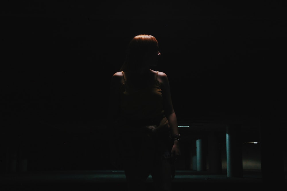 woman standing near empty car park