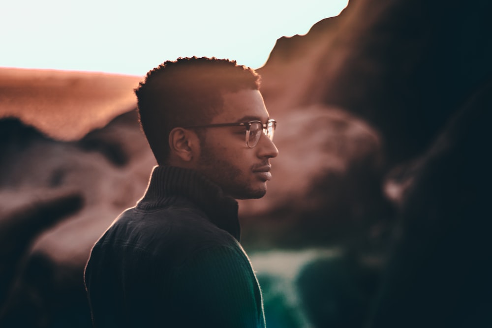 selective focus photo of man looking right side view