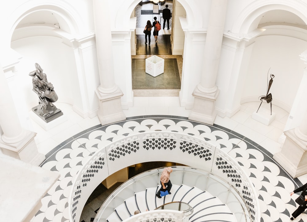 person walking upstairs inside building