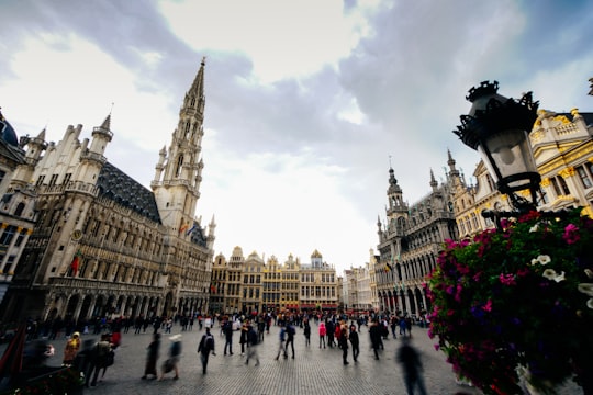 people walking on the street in Grand Place, Brussels Town Hall Belgium