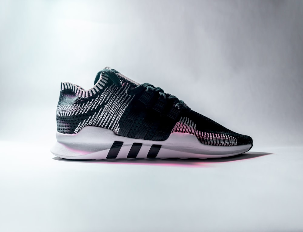 Unpaired black and white adidas low-top sneaker photo – Free France Image  on Unsplash