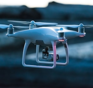 photo of white flying quadcopter