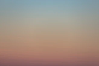 A serene space with soft peach and lavender tones, inviting calm and reflection.