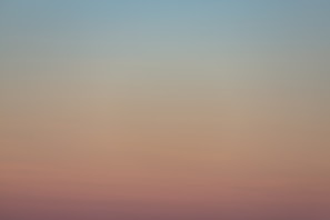 Subtle gradient of soft pinks and lavenders creating a peaceful atmosphere