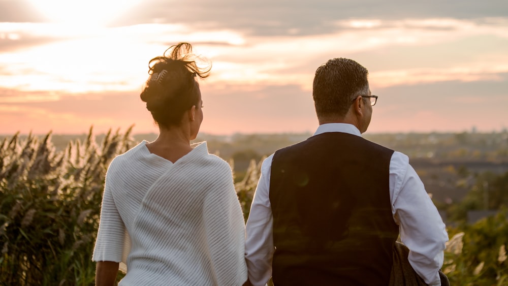 man and woman standing outside during daytime