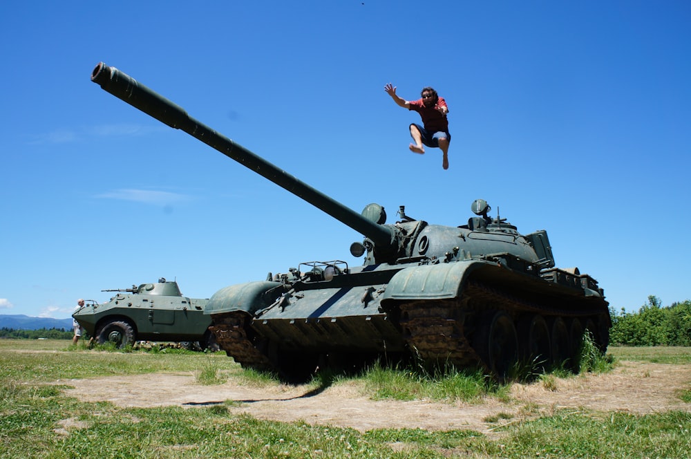 man jumping above Russian tank