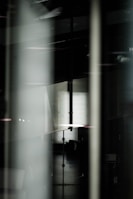 Abstract composition showing layered dark materials with a moody atmosphere.