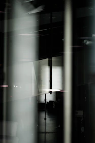 Abstract composition of intersecting lines and shadows evoking precision and balance.