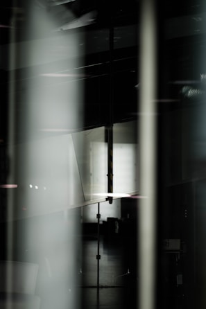 Abstract composition showing layered dark materials with a moody atmosphere.