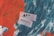 A textured abstract background with bold strokes of orange and dark teal. Two pieces of paper with the words 'Art' and 'Advocacy' written on them are prominently placed in the center.