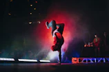 man doing breakdancing on gray surface