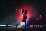 man doing breakdancing on gray surface
