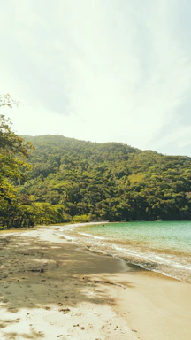 A sunlit beach villa with golden sands and turquoise waves, perfect for a joyful group getaway.