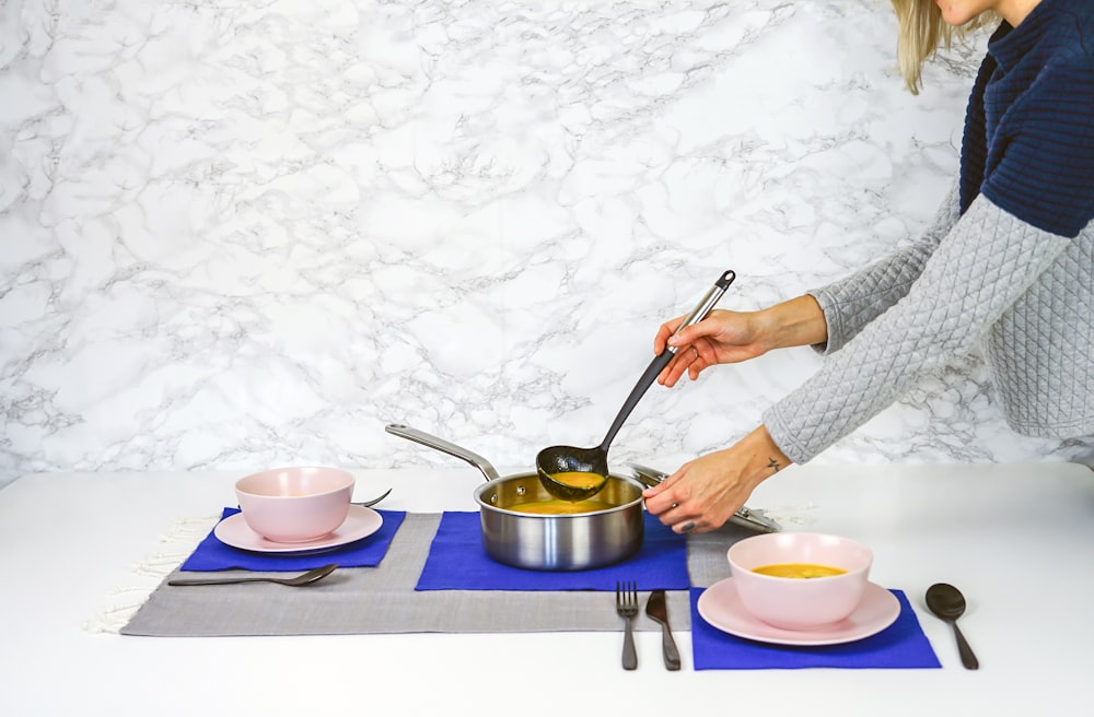 woman serving soup