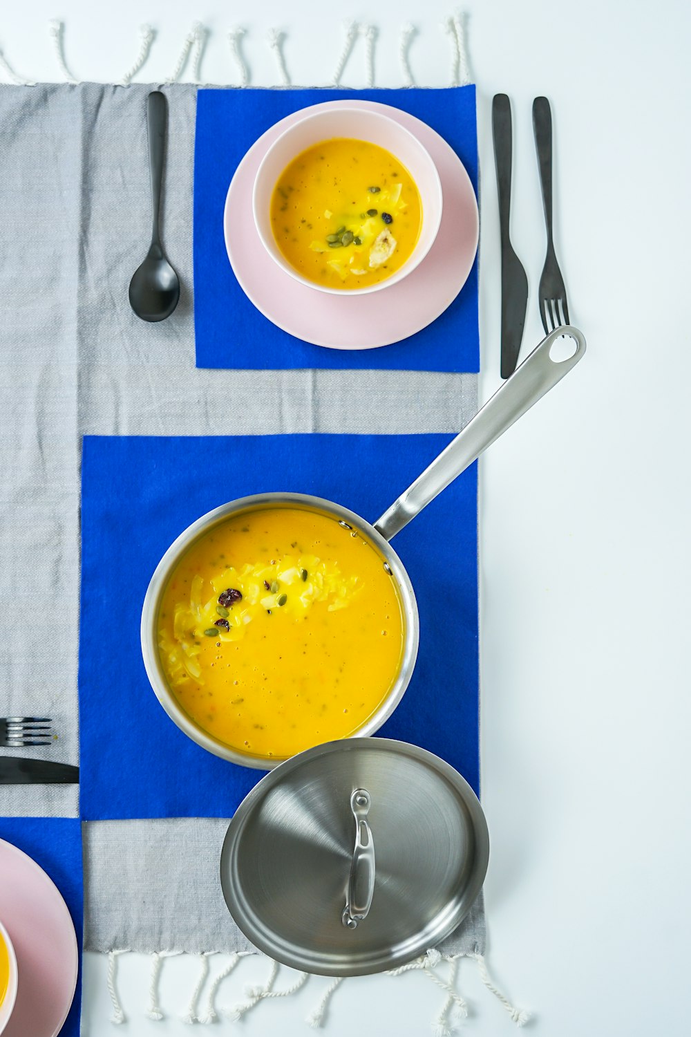 silver sauce pan with squash puree