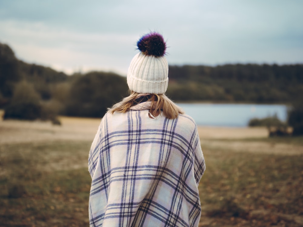 woman standing on green grass