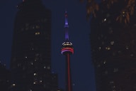 a tall building with a red, white and blue light on it's side