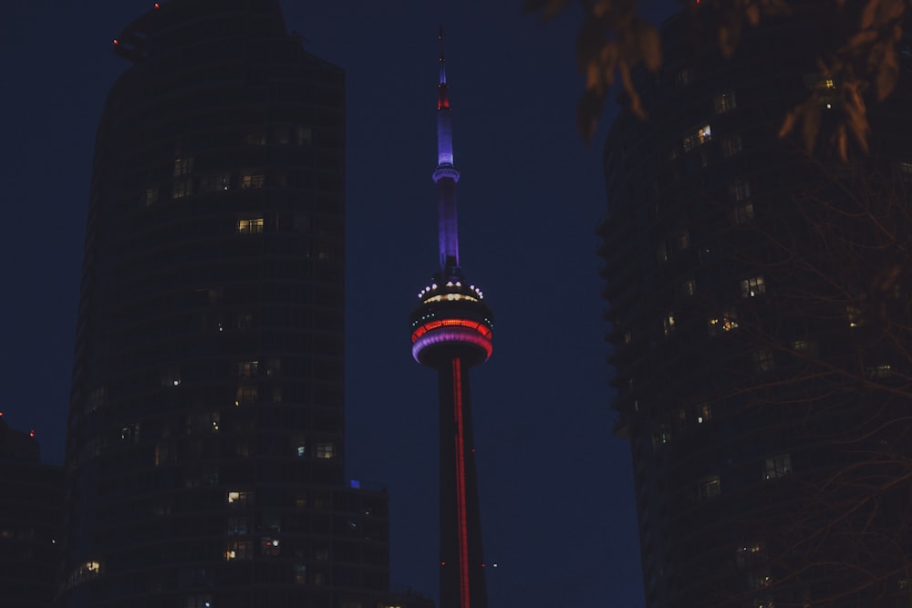 a tall building with a red, white and blue light on it's side