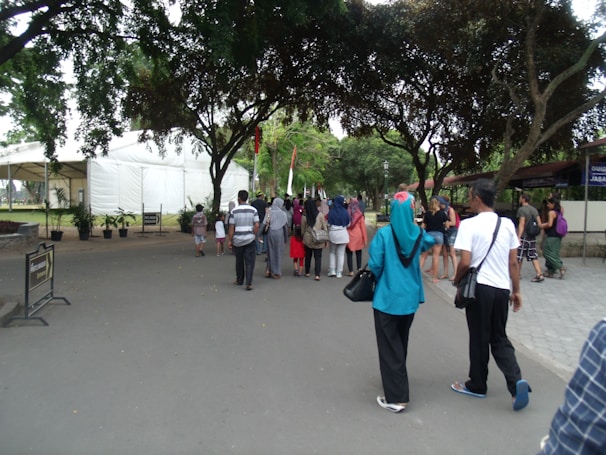 A diverse group of people walking outdoors in nature