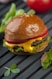 cheese burger on a wooden surface