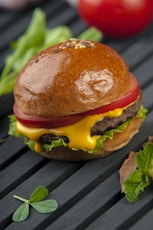 cheese burger on a wooden surface