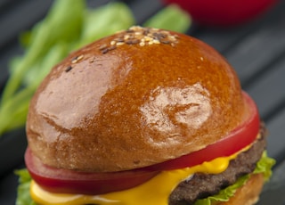 cheese burger on a wooden surface