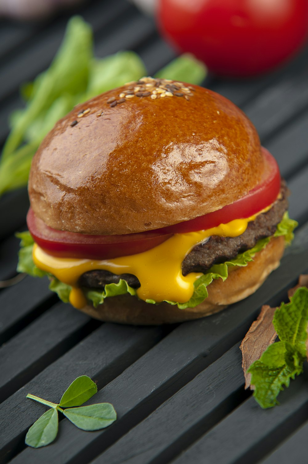 cheese burger on a wooden surface