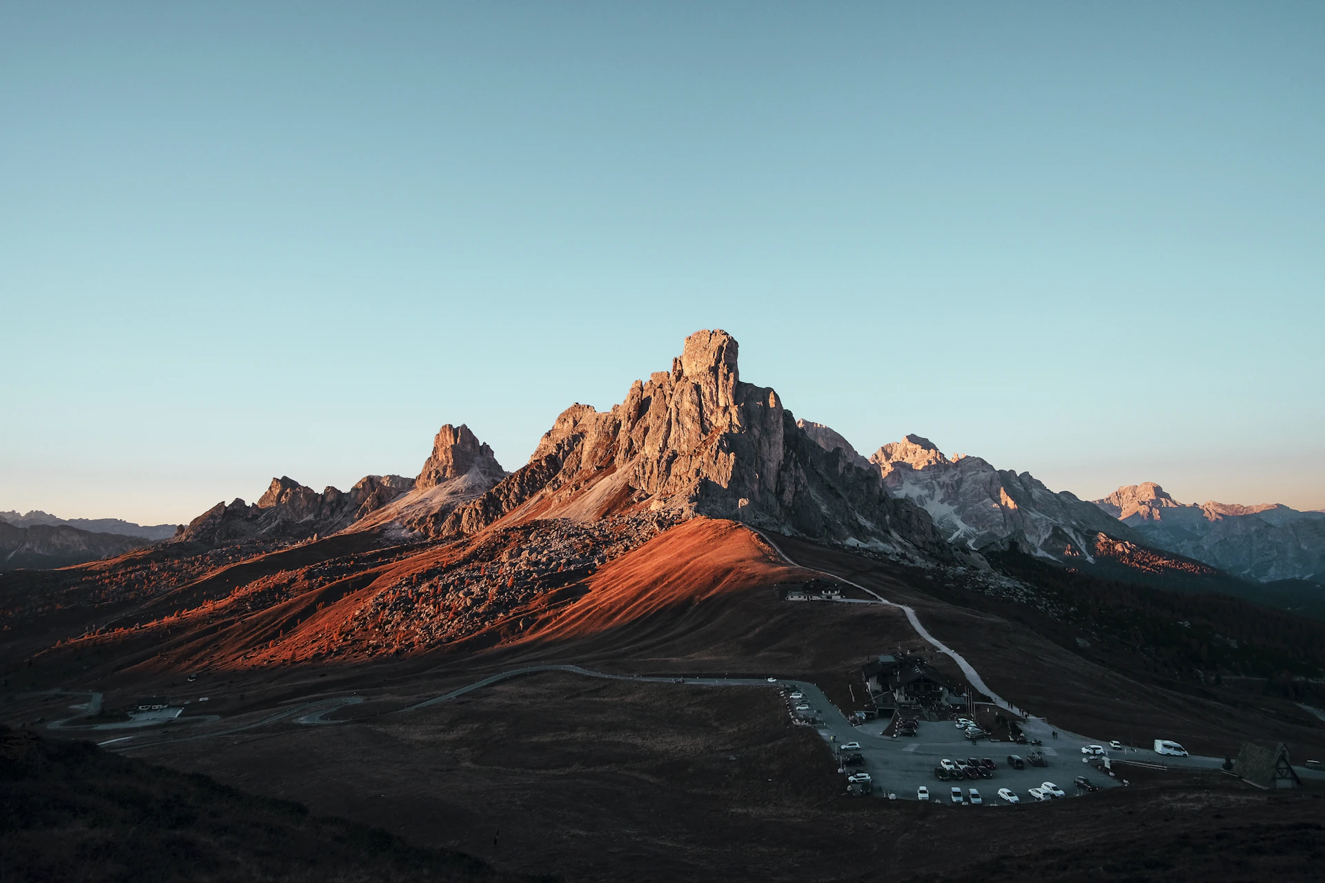Mountain peaks emerging from clouds at sunrise