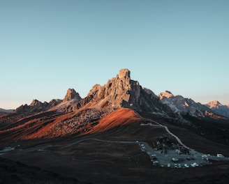 brown rock formation under blue sky