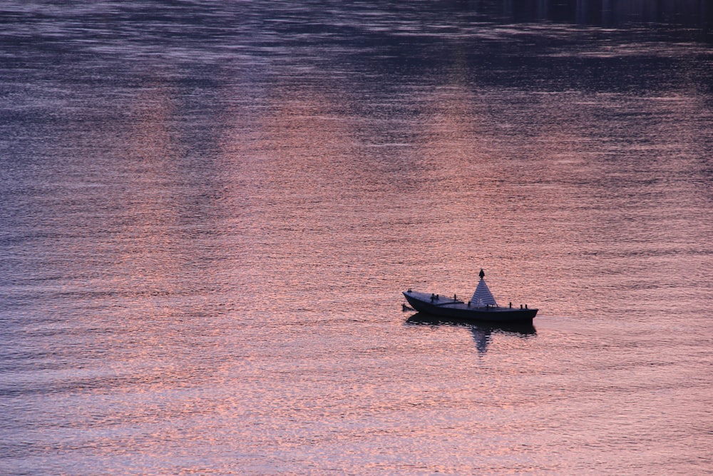 gray boat on boy of water