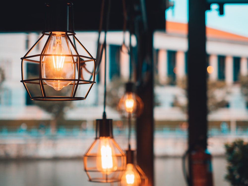 brass-colored pendant lamps