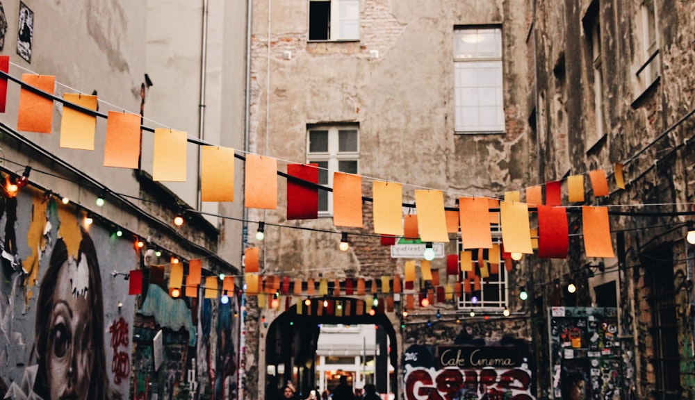 photo of buntings hanged near graffiti artworks