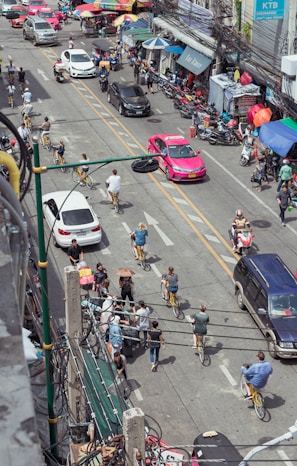 A bustling cityscape with bikers navigating through traffic.