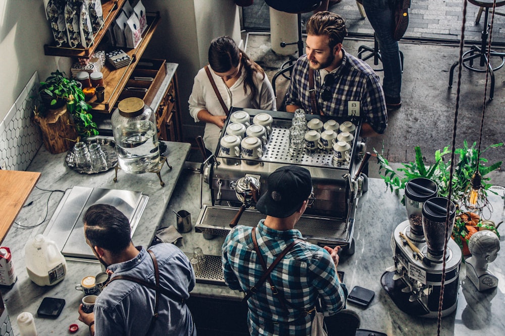 man buying coffee on counter